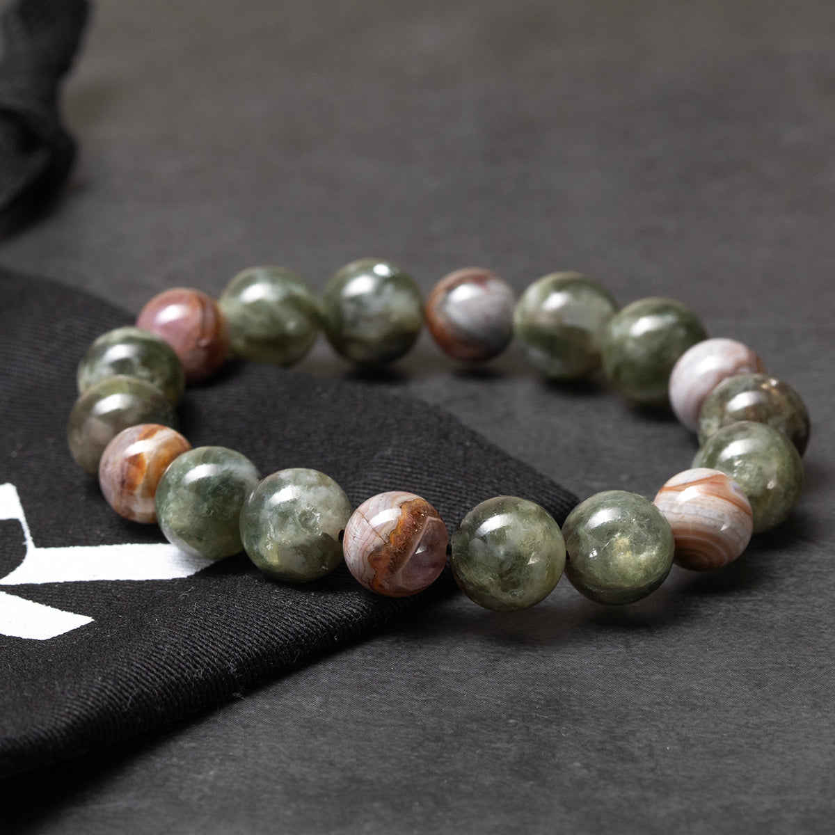 Multicolored beaded bracelet on a dark surface