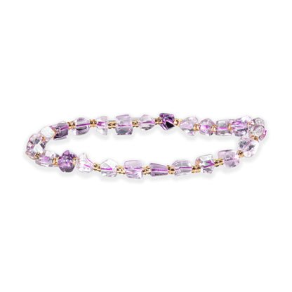 Purple beaded bracelet on a white background