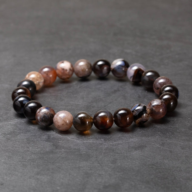 Beaded bracelet with multicolored beads on a dark gray background