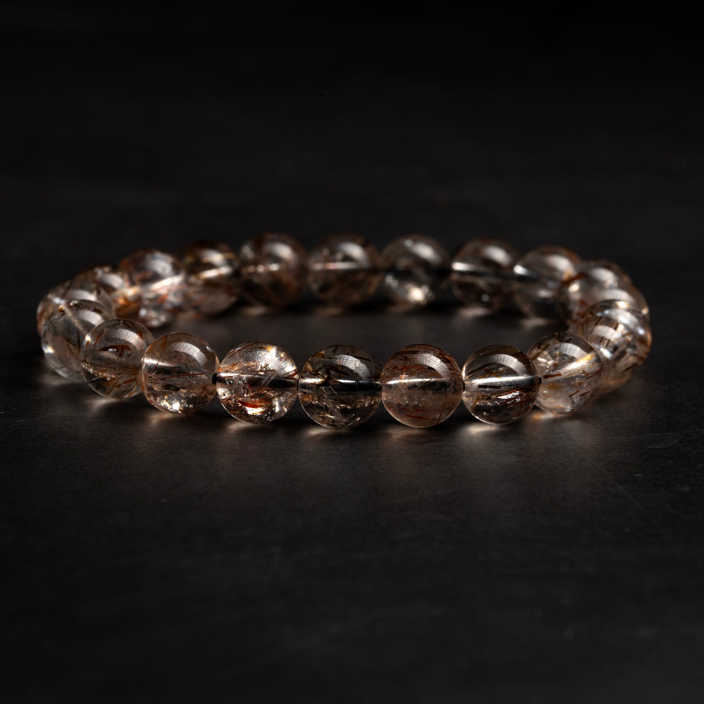 Beaded bracelet on a dark surface