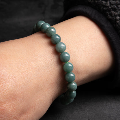 green beaded bracelet worn on the wrist