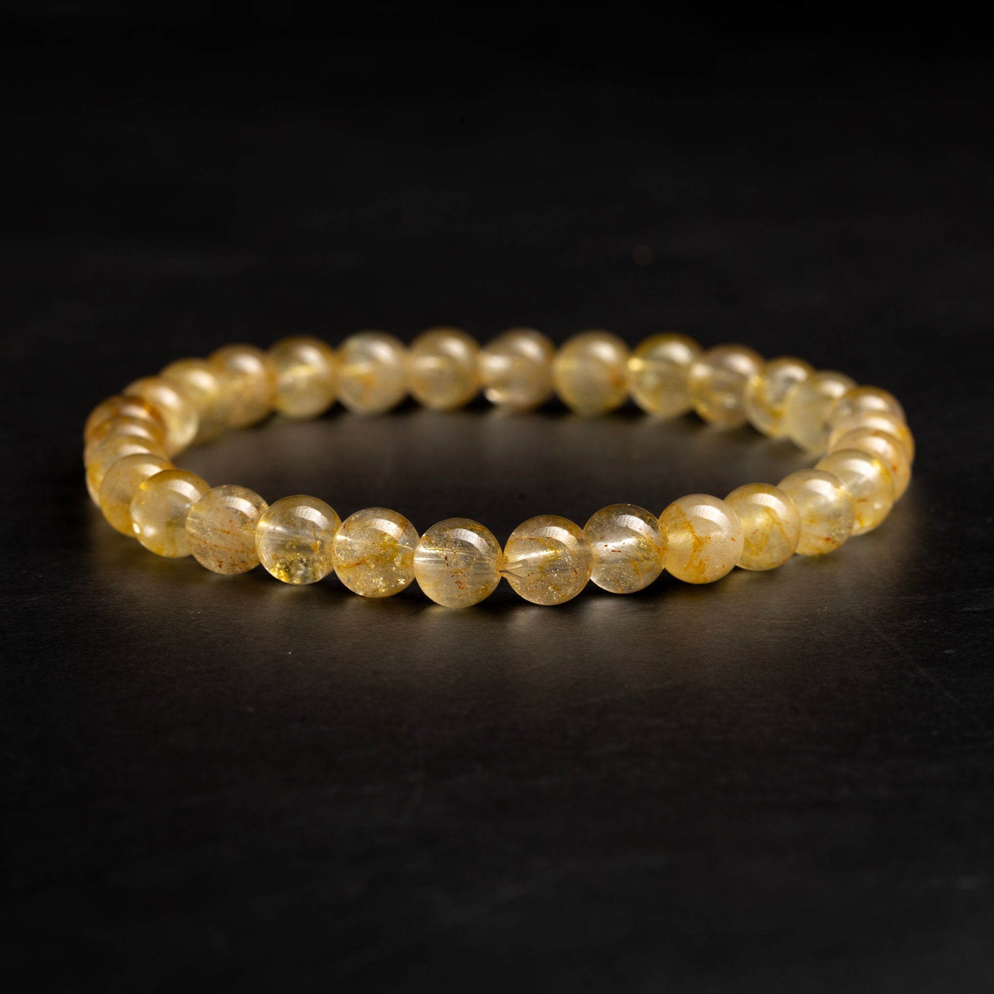 yellow bracelet on a dark background