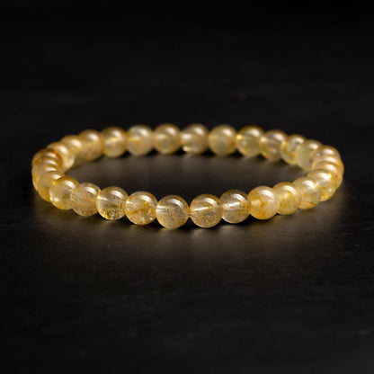 yellow bracelet on a dark background
