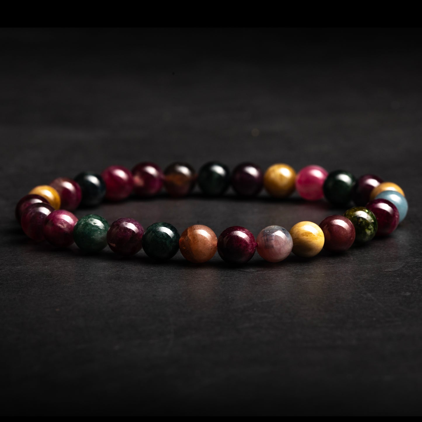 Multicolored beaded bracelet on a dark background