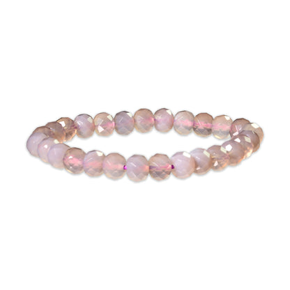 Beaded bracelet with pink and purple stones on a white background