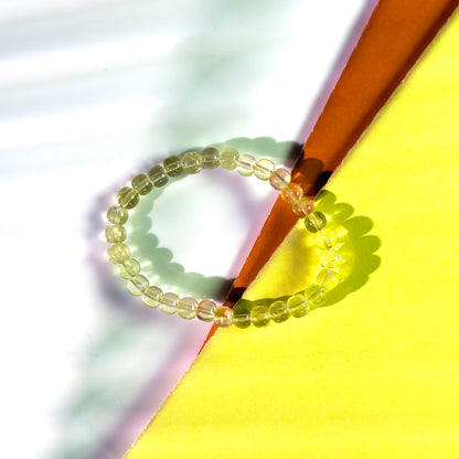 Beaded bracelet on a colorful geometric background