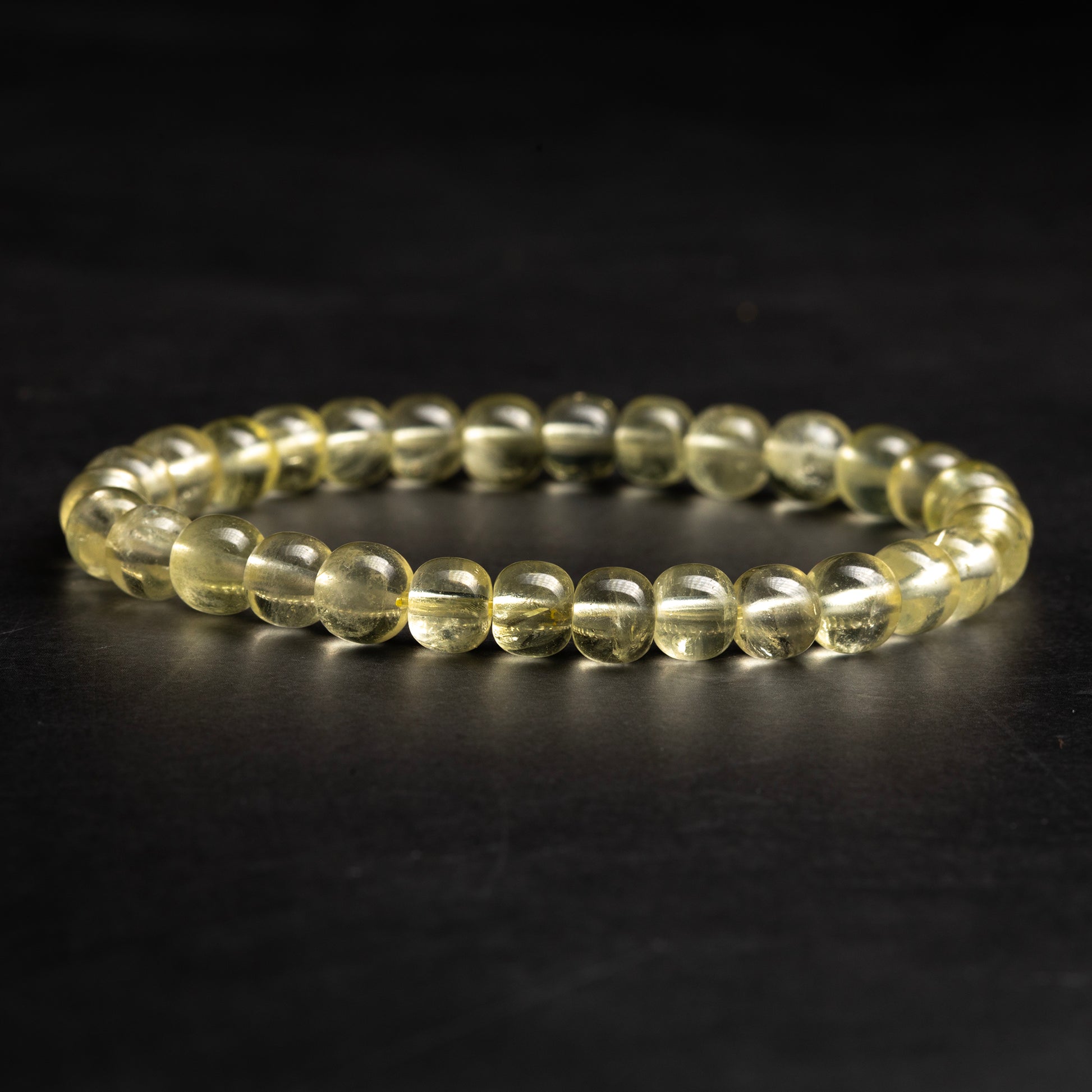 Beaded bracelet with clear stones on a dark background