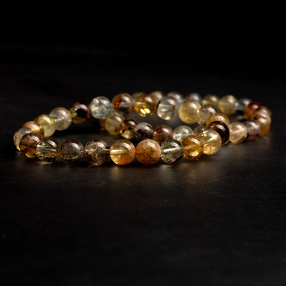 Multicolored beaded bracelet on a dark surface