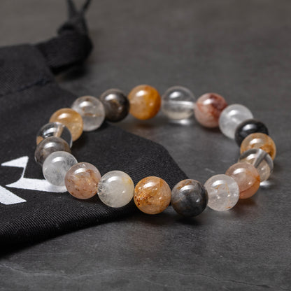 Multicolored beaded bracelet on a dark gray surface