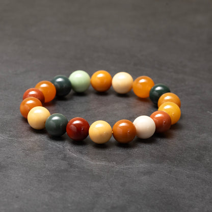 Multicolored beaded bracelet on a dark gray background