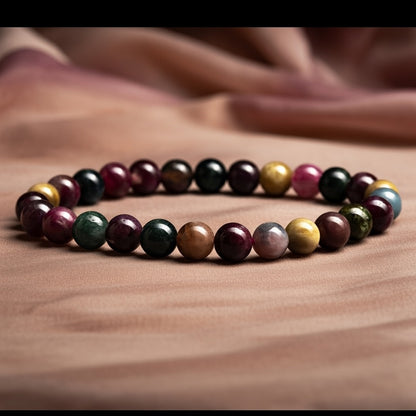Multicolored beaded bracelet on a brown fabric background