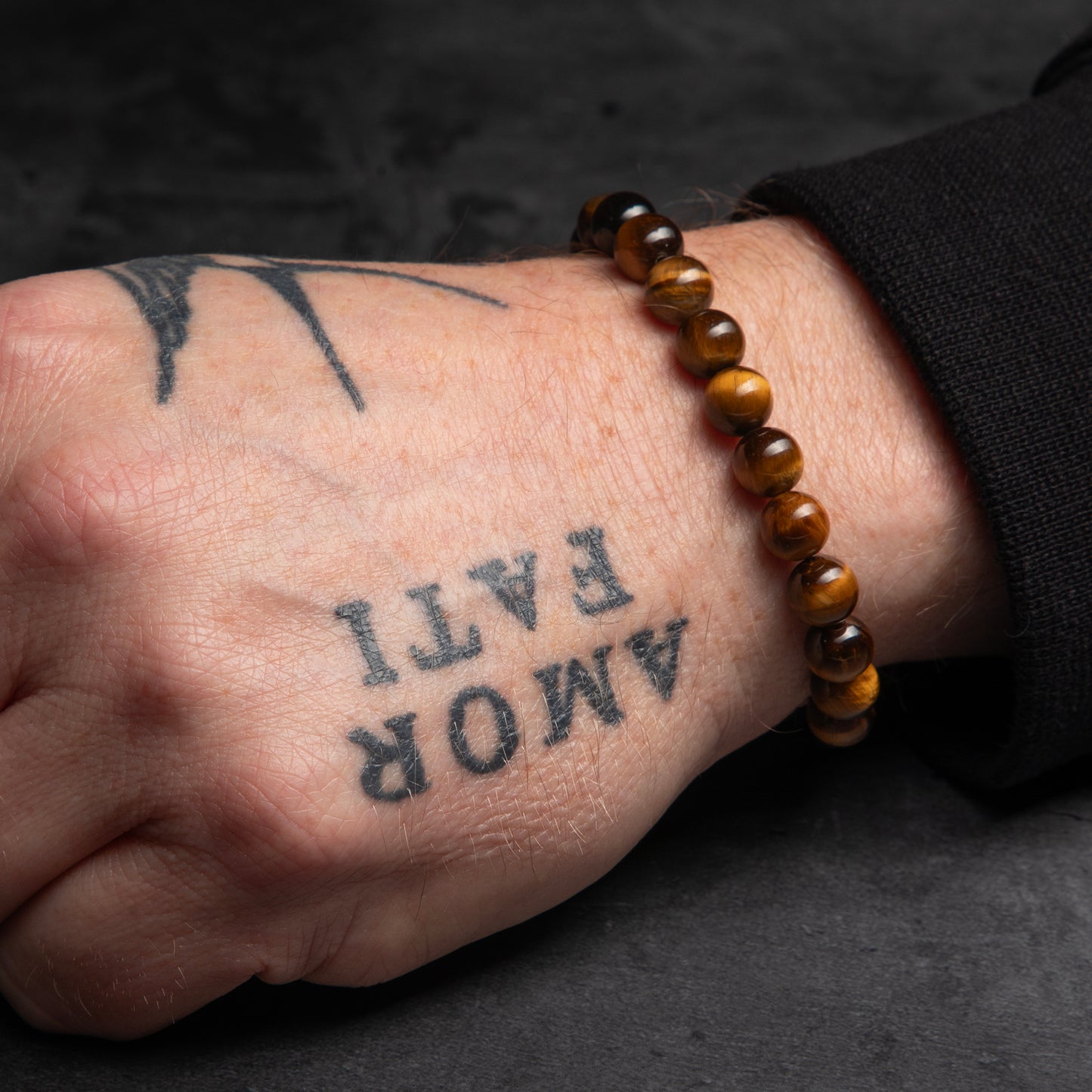 tiger eye bracelet on a man's wrist